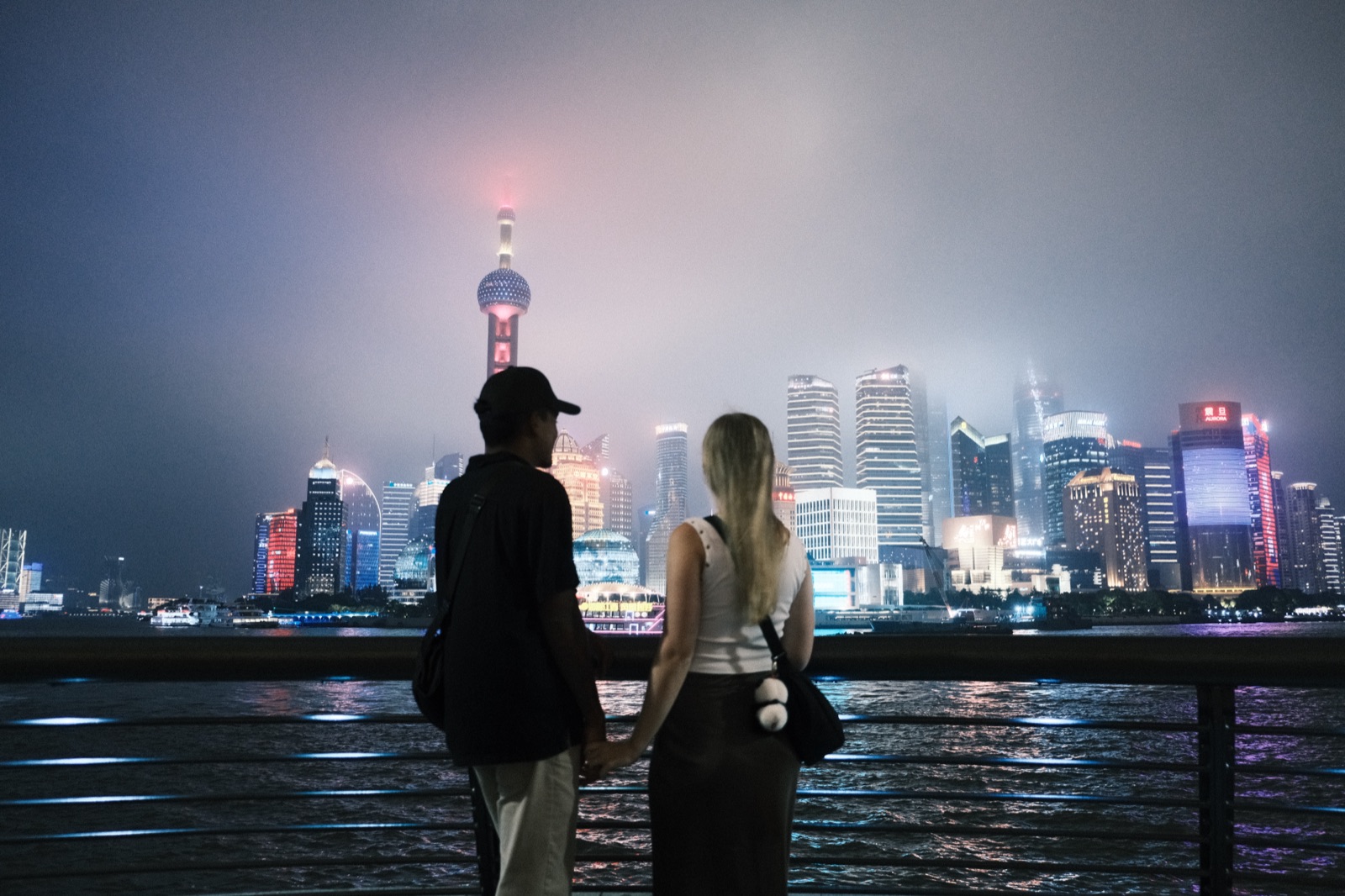 Artur and Michelle watching the Shanghai skyline at night